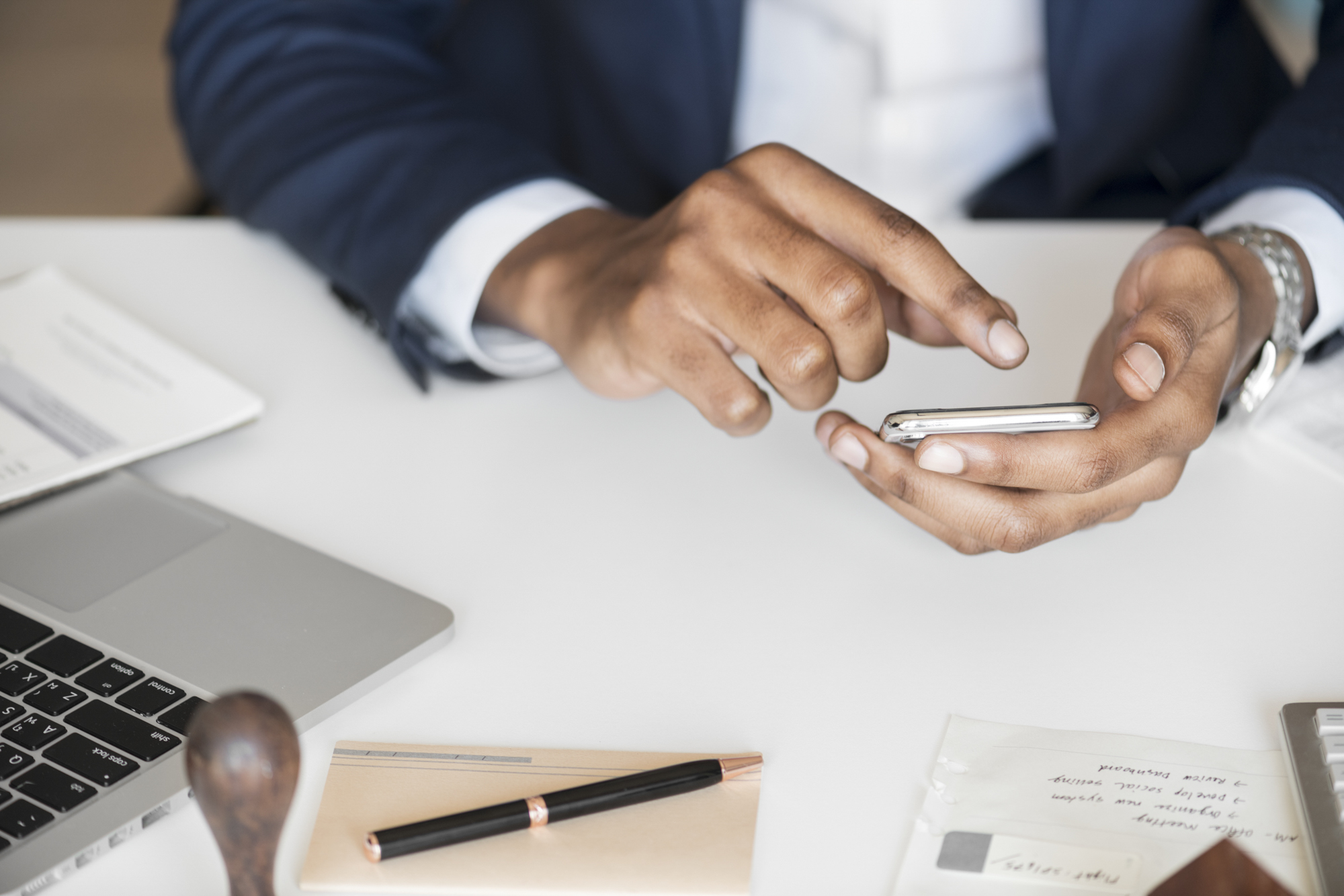 Closeup Of Businessman Using Mobile Phone